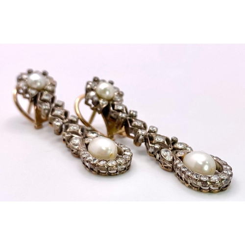 706 - A Pair of 14K Yellow Gold, Diamond and Pearl Art Deco Drop Earrings. Beautifully crafted with bright... 