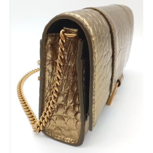 713 - Introducing the Balenciaga Hourglass Bag in a stunning gold hue – a true embodiment of luxury and co... 