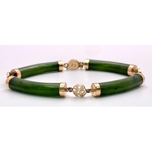 720 - A 14K Yellow Gold, Jade Bar Bracelet. Curved green jade bars with Chinese calligraphy spacers. 18cm.... 