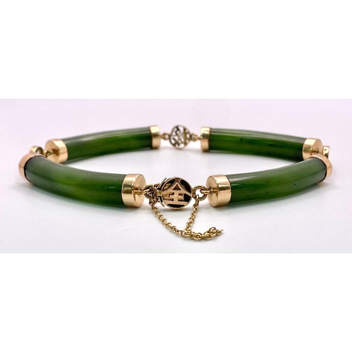 720 - A 14K Yellow Gold, Jade Bar Bracelet. Curved green jade bars with Chinese calligraphy spacers. 18cm.... 