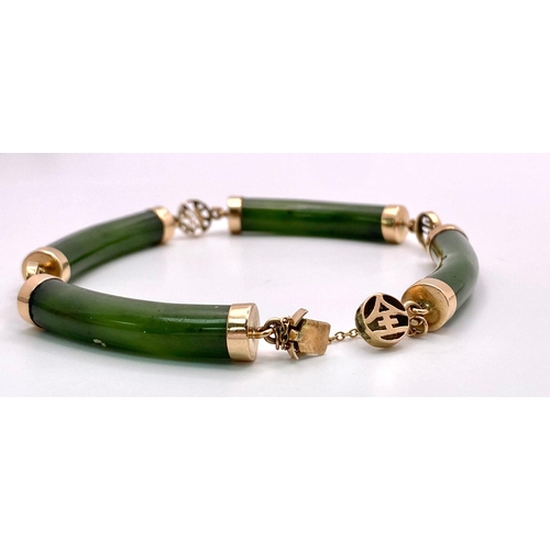 720 - A 14K Yellow Gold, Jade Bar Bracelet. Curved green jade bars with Chinese calligraphy spacers. 18cm.... 