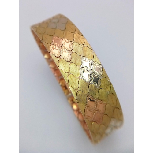 92 - An Italian 18K Gold Tri-Colour Bracelet. An incredible piece of craftmanship with diamond mesh patte... 