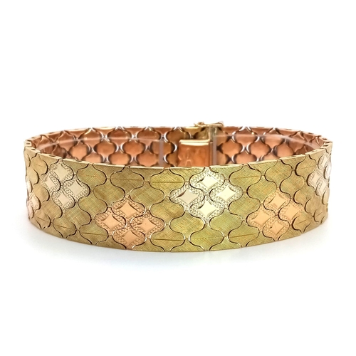 92 - An Italian 18K Gold Tri-Colour Bracelet. An incredible piece of craftmanship with diamond mesh patte... 