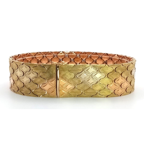 92 - An Italian 18K Gold Tri-Colour Bracelet. An incredible piece of craftmanship with diamond mesh patte... 