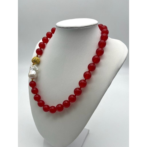 1179 - A Bright Red Jade Bead Necklace with a Large Baroque Pearl Interrupter - and a Gilded White Stone Gl... 