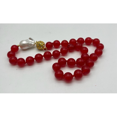 1179 - A Bright Red Jade Bead Necklace with a Large Baroque Pearl Interrupter - and a Gilded White Stone Gl... 