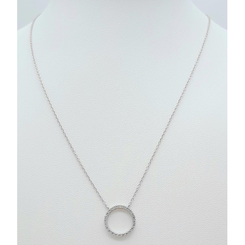 1302 - A 925 Silver Necklace with a Circular gemmed pendant.
Measures 44cm in length.
Weight: 2.42g