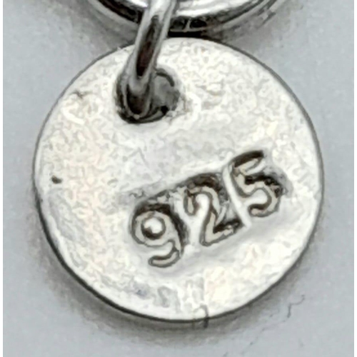 1302 - A 925 Silver Necklace with a Circular gemmed pendant.
Measures 44cm in length.
Weight: 2.42g