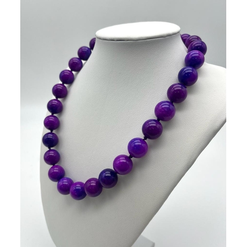 1606 - A Charming Purple Sugilite Large Bead Gemstone Necklace. 
Beads - 14mm. Necklace length - 42cm.