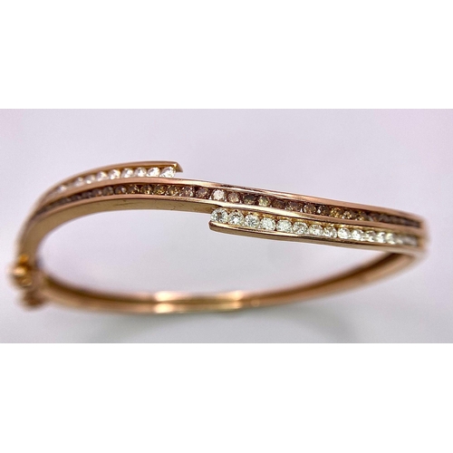 959 - A 14K Rose Gold, White and Cognac Brown Diamond Wave Bangle. Over 60 round cut diamonds ride on a wa... 