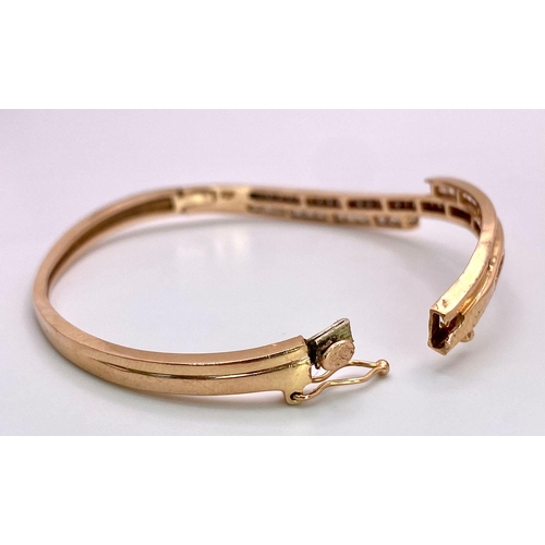 959 - A 14K Rose Gold, White and Cognac Brown Diamond Wave Bangle. Over 60 round cut diamonds ride on a wa... 