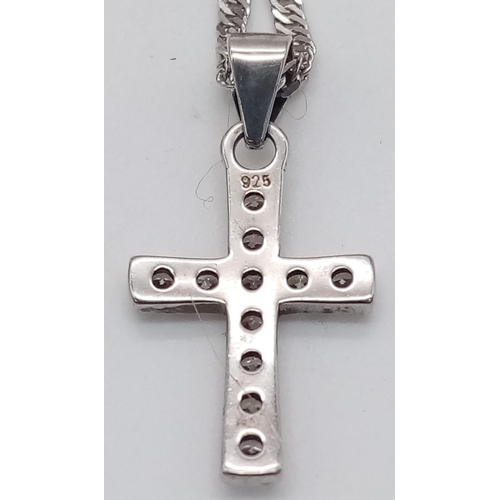 1295 - A 925 Silver necklace with a gemmed Crucifix.
Measures 44cm in length
Weight: 2.86g