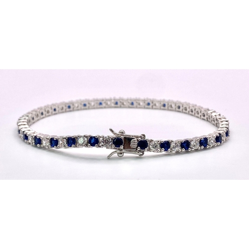 947 - A 925 Silver, Blue & White Stone Tennis Bracelet.
Measures 20cm in length.
Weight: 12.5g