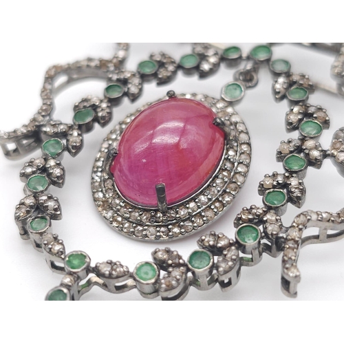 1239 - A unique Ruby, Emerald, Opal & Diamond, Sterling Silver Brooch.
The central 12ct Ruby, surrounded by... 