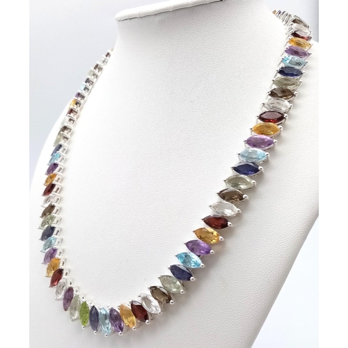 1267 - A dazzling Marquise Cut Gemstone Tennis Necklace set in 925 Silver. Featuring a wide variety of gems... 