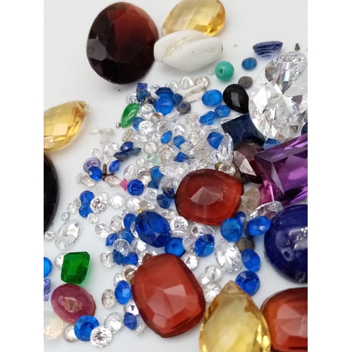 1323 - A Parcel of Loose Cut Gem Stones.
A mixed variety of colours, types and sizes.