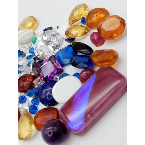 1323 - A Parcel of Loose Cut Gem Stones.
A mixed variety of colours, types and sizes.