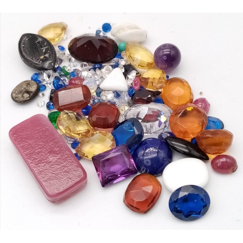 1323 - A Parcel of Loose Cut Gem Stones.
A mixed variety of colours, types and sizes.