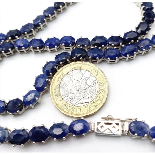 1365 - A classy Oval-cut Blue Sapphire gemstone, Sterling Silver, Long Necklace. Measures 47cm in length an... 