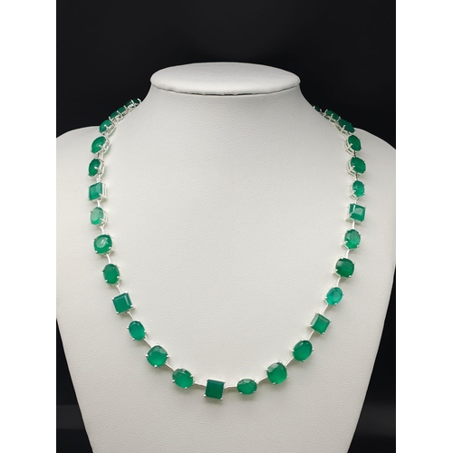 1372 - A gleaming Emerald gemstone, Sterling Silver, Tennis Necklace. Measures 42cm in length and weighs 32... 