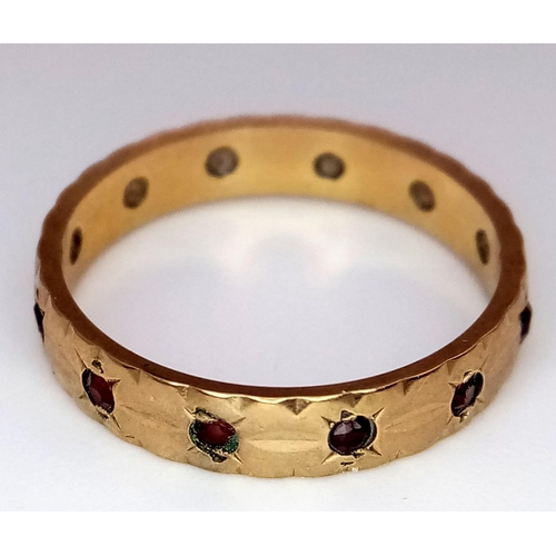 1414 - A Vintage 9K Yellow Gold Garnet Eternity Ring. Size M. 2.1g total weight.