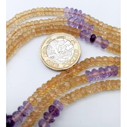 1428 - A beautiful three-row beaded necklace made up of citrine and amethyst gemstones, with a 925 silver c... 