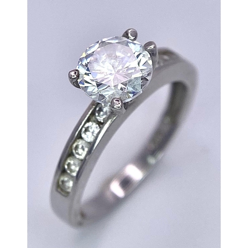 1572 - Stunning Sterling Silver, Round-Cut Cubic Zirconia Ring.
Multiple stones accompany on the shoulders ... 