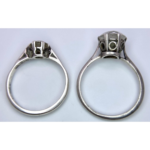 1615 - 2X silver Cubic Zirconia solitaire rings. Total weight 3.5G. Size: M and K.