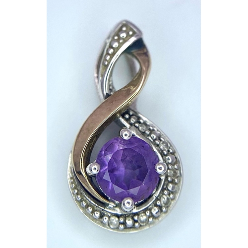 1656 - A 9K White and Yellow Gold, Amethyst with Diamonds Pendant. 20mm. 1.1g total weight.