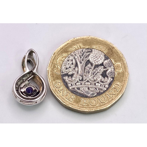 1656 - A 9K White and Yellow Gold, Amethyst with Diamonds Pendant. 20mm. 1.1g total weight.