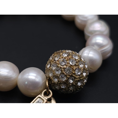 2004 - A Cultured Pearl Necklace and Bracelet Set with Glitterball Decoration. Necklace - 40cm. Bracelet - ... 