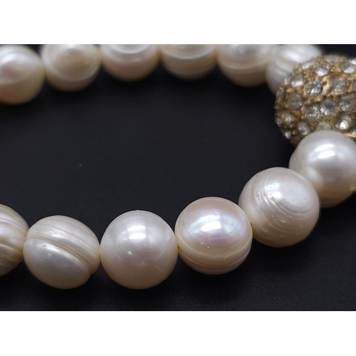 2004 - A Cultured Pearl Necklace and Bracelet Set with Glitterball Decoration. Necklace - 40cm. Bracelet - ... 