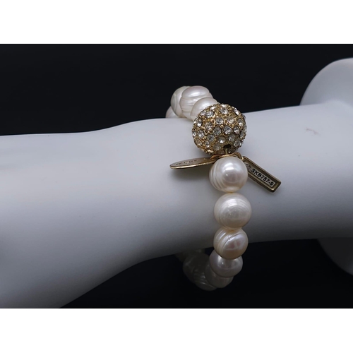 2004 - A Cultured Pearl Necklace and Bracelet Set with Glitterball Decoration. Necklace - 40cm. Bracelet - ... 