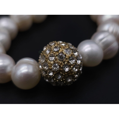 2004 - A Cultured Pearl Necklace and Bracelet Set with Glitterball Decoration. Necklace - 40cm. Bracelet - ... 