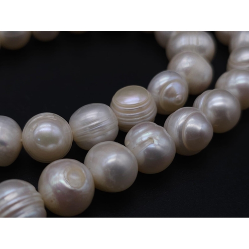 2004 - A Cultured Pearl Necklace and Bracelet Set with Glitterball Decoration. Necklace - 40cm. Bracelet - ... 