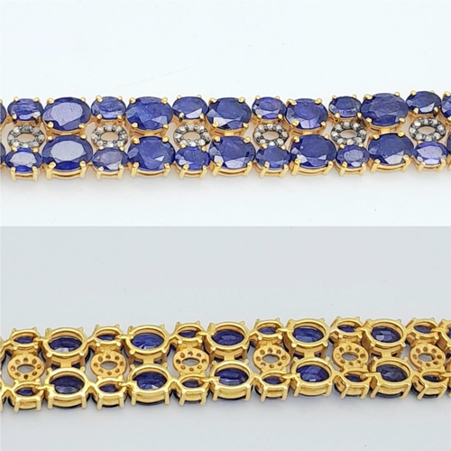 1232 - A glamorous Blue Sapphire & Diamond, Gold gilded Sterling Silver, Tennis Bracelet. 
50cts of Blue Sa... 