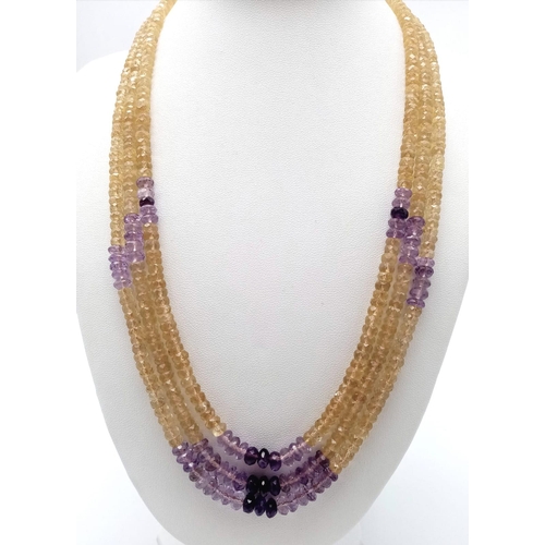 1428 - A beautiful three-row beaded necklace made up of citrine and amethyst gemstones, with a 925 silver c... 