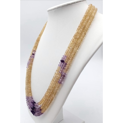 1428 - A beautiful three-row beaded necklace made up of citrine and amethyst gemstones, with a 925 silver c... 