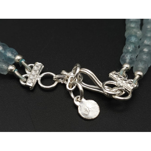 1435 - An iridescent, double row Aquamarine Gemstone Necklace with a 925 Silver clasp.
Total weight: 50.23g... 