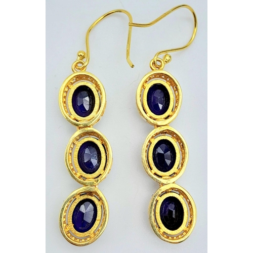 1470 - A delightful pair of Blue Sapphire & Diamond, Gold gilded Sterling Silver, Pendulous Earrings.
12cts... 