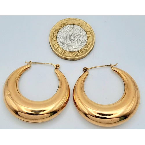 1596 - A Pair of Classic Crescent Hoop 9K Yellow Gold Earrings. 
3.76g total weight.