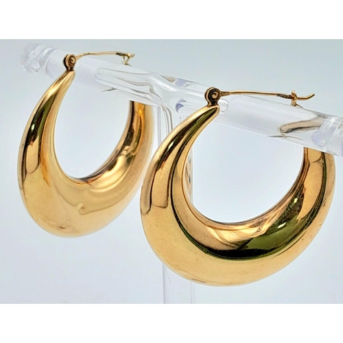 1596 - A Pair of Classic Crescent Hoop 9K Yellow Gold Earrings. 
3.76g total weight.