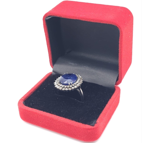 1720 - A fabulous 9ct Blue Sapphire, Sterling Silver Ring.
The central stone is surrounded by two rows of D... 