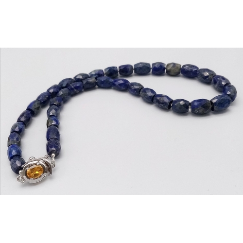 1727 - A delightful Drum-Cut, Lapis Lazuli Necklace with a Citrine, 925 Silver clasp. This stylish necklace... 