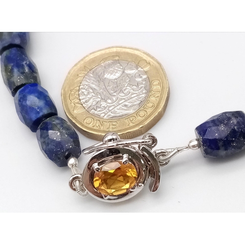 1727 - A delightful Drum-Cut, Lapis Lazuli Necklace with a Citrine, 925 Silver clasp. This stylish necklace... 