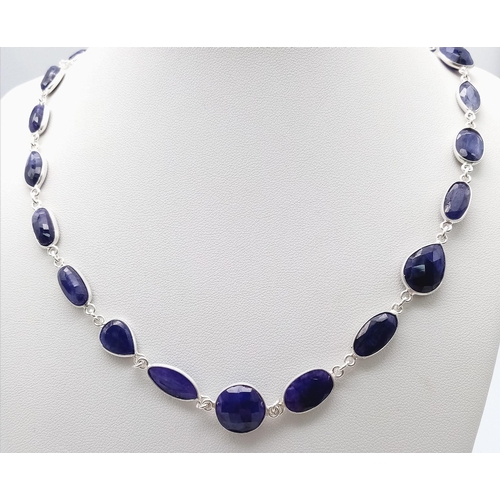 1741 - A stylish Blue Sapphire long chain necklace, set in Sterling Silver. This classic necklace measures ... 