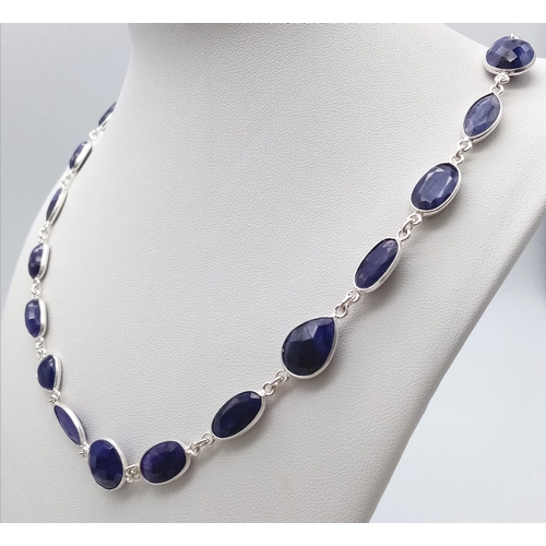 1741 - A stylish Blue Sapphire long chain necklace, set in Sterling Silver. This classic necklace measures ... 