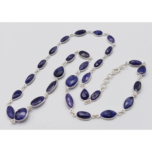 1741 - A stylish Blue Sapphire long chain necklace, set in Sterling Silver. This classic necklace measures ... 