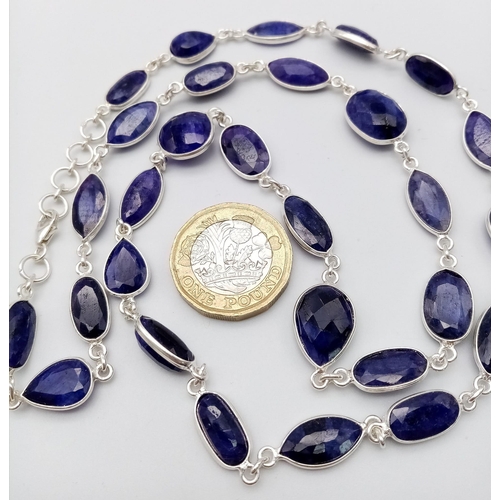 1741 - A stylish Blue Sapphire long chain necklace, set in Sterling Silver. This classic necklace measures ... 