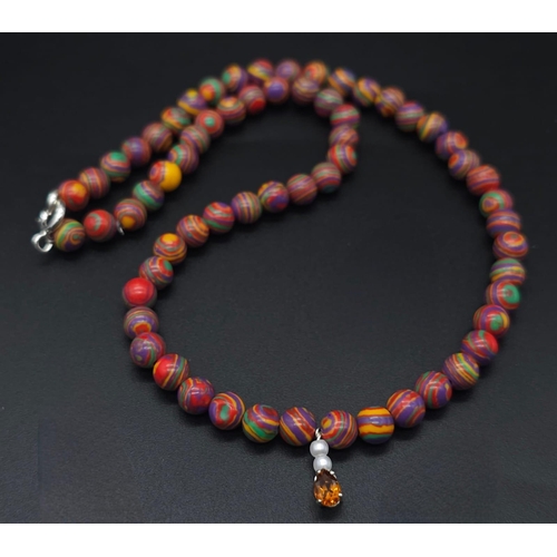 1998 - A trio of colourful 925 Silver Necklaces.
1) Blue beaded necklace, 925 clasp, amber stone pendant (5... 